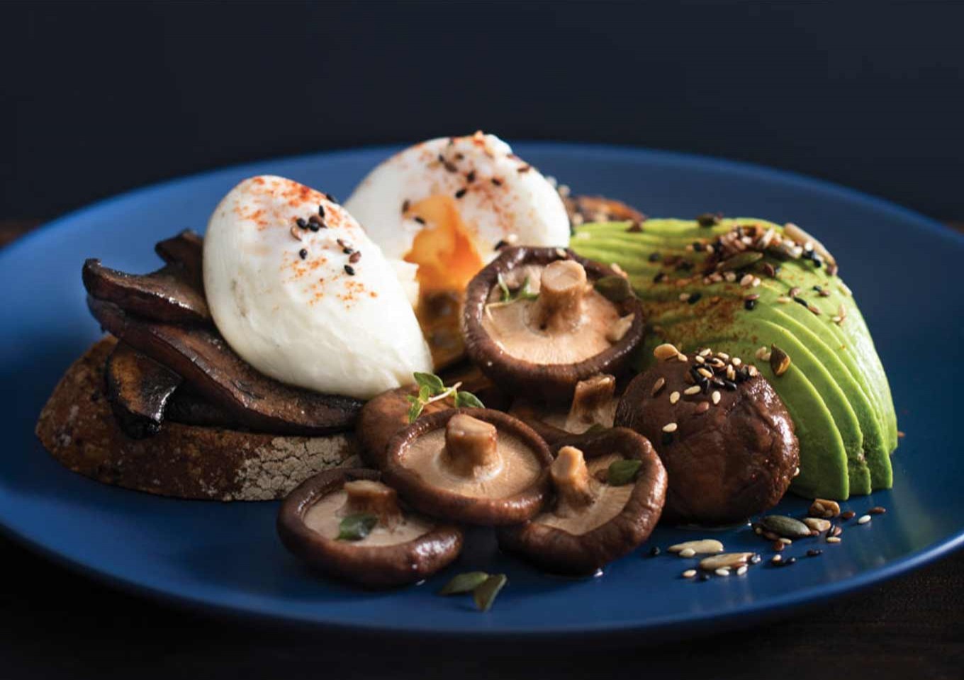 Mushrooms on toast with poached eggs, pickled shiitake and avocado